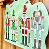 Songbird Grove Collection - Festive Nutcracker Door Hanger